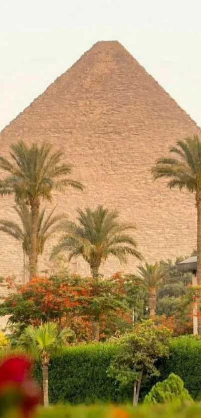 Pyramid surrounded by lush oasis and palm trees.