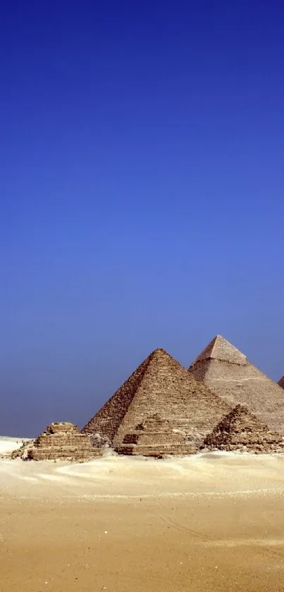 Mobile wallpaper of Egyptian pyramids under a clear blue sky in a desert landscape.