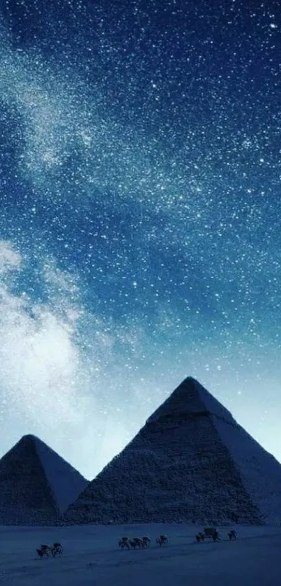 Pyramids illuminated under a starry night sky, creating a breathtaking view.