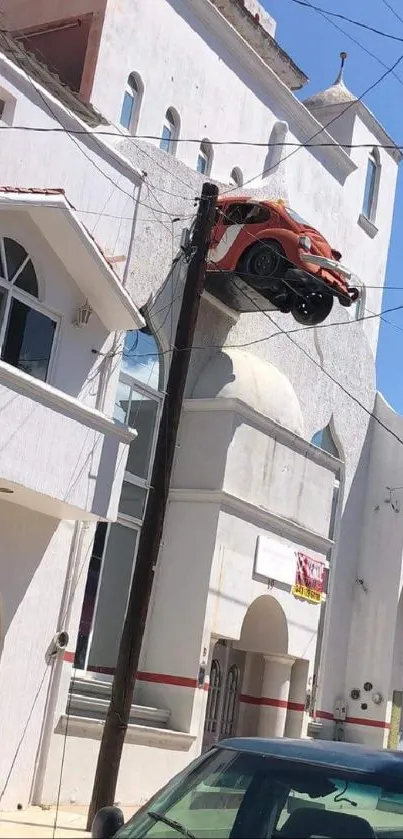 Mobile wallpaper featuring a car mounted on a white building wall.