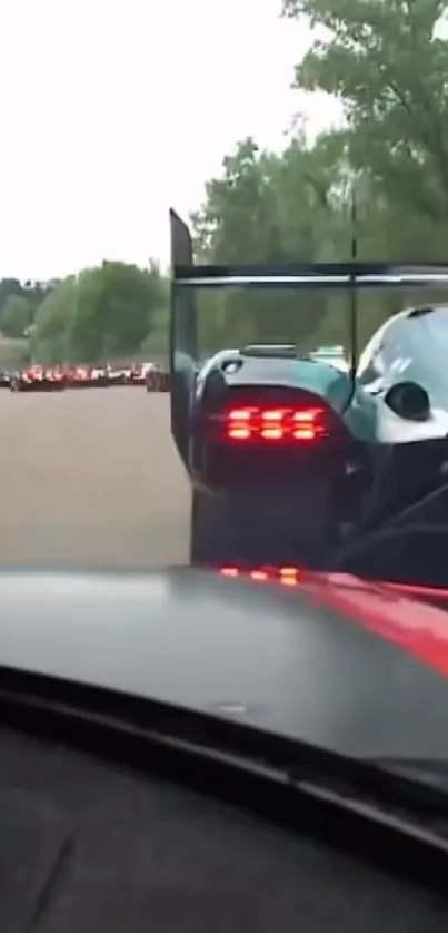 Race cars on a track at high speed.