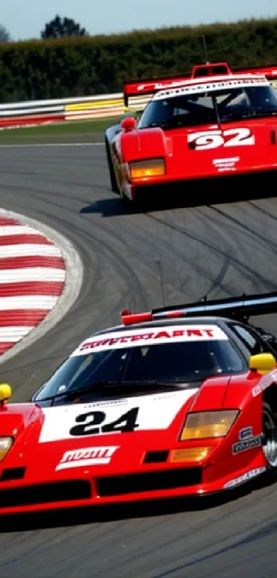 Red racing cars on a curved track background.