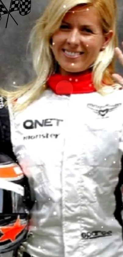 Female racer smiling in racing gear holding a helmet.