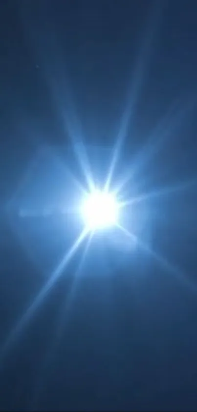 A bright burst of light against a deep blue background.