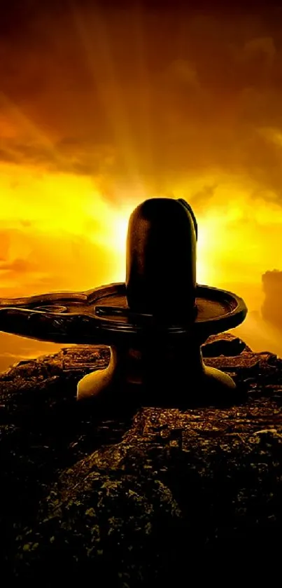 Divine Shivling silhouette under a radiant golden sunset.