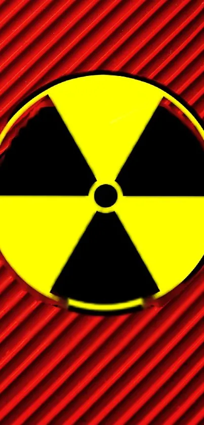 Bold wallpaper with a yellow radiation symbol on red background.