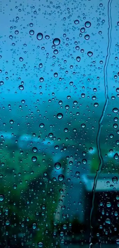 Raindrops on a window with a blue landscape background