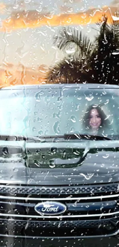 Car with raindrops and sunset view, featuring palm trees.