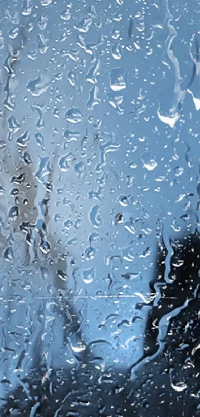 Raindrops on glass with a calming blue background, perfect for mobile wallpaper.