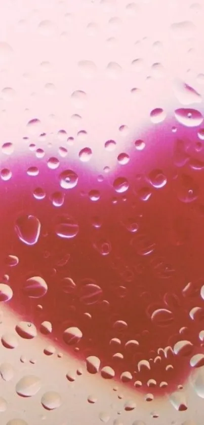 Pink heart with raindrops on phone wallpaper.