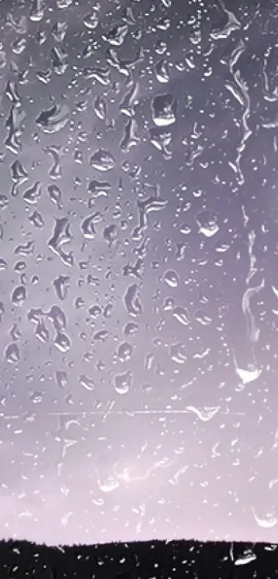 Raindrops on window with a purple sky background.