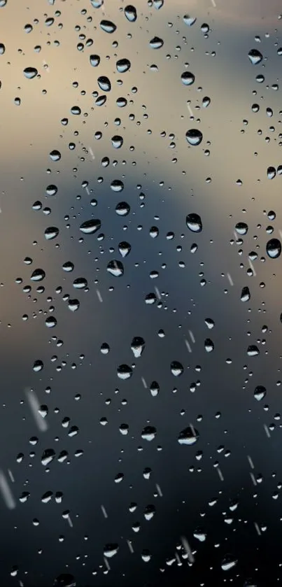 Mobile phone wallpaper featuring raindrops on glass with a blue-gray background.