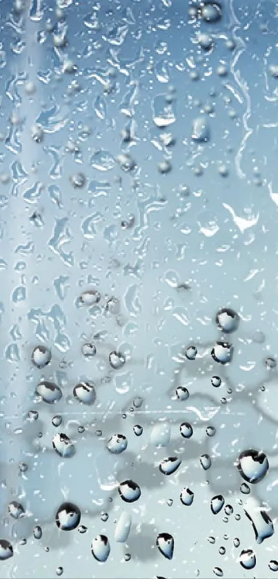 Serene wallpaper with raindrops on a pane against a light blue sky.