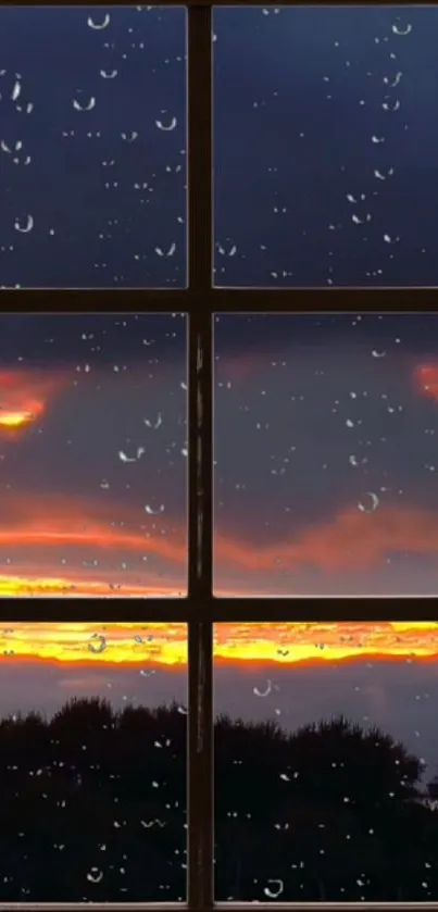 Raindrops on window with sunset view, orange sky and silhouetted trees.