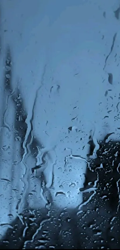 Raindrops on blue-tinted glass create a serene mobile wallpaper.