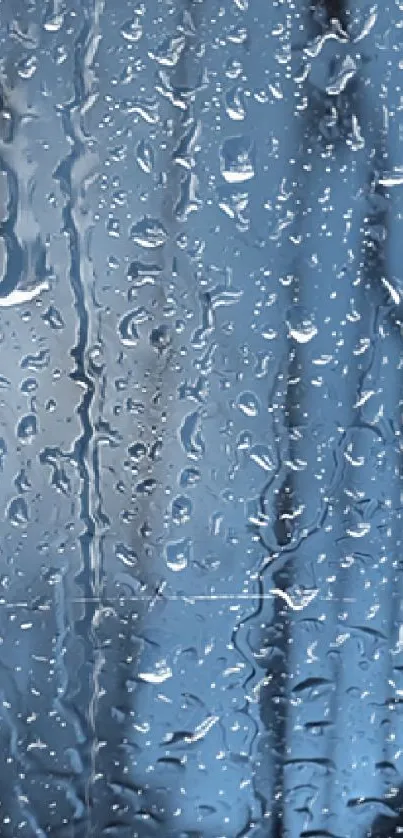 Wallpaper showing raindrops on blue glass for phone background.