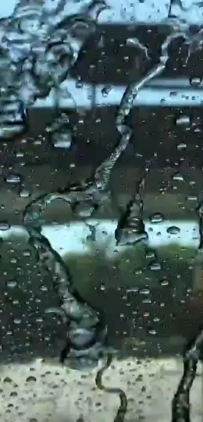 Raindrops on a glass window with a serene blue background.