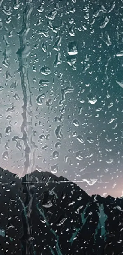 Raindrops on a window with a mountain view in the background.