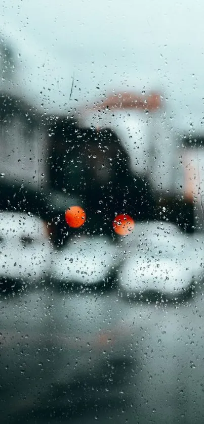 Blurred city scene with raindrops on glass.