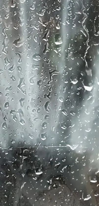 Raindrops on a window creating a calm and serene wallpaper for mobile devices.