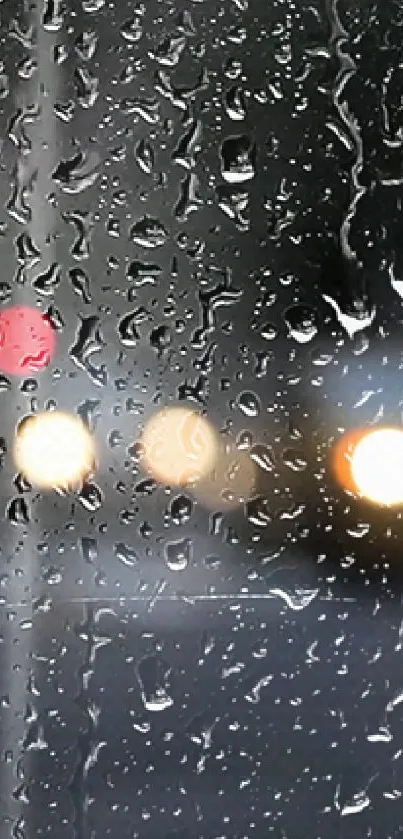 Raindrops on a window with blurred city lights in the background.