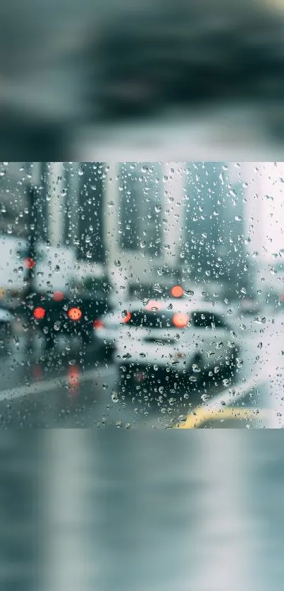 Rainy city view through a wet window with blurred lights.