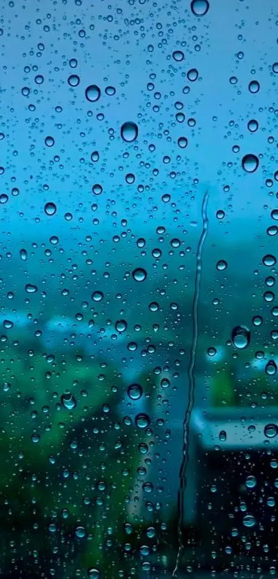 Raindrops on window with a blue backdrop.