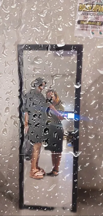 Rainy day reflection of couple in mirror wallpaper.