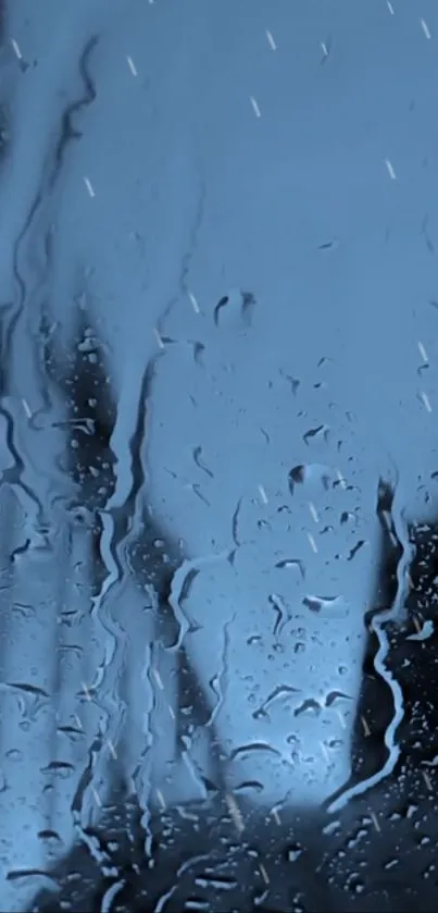 Rainy glass with blue hues mobile wallpaper.