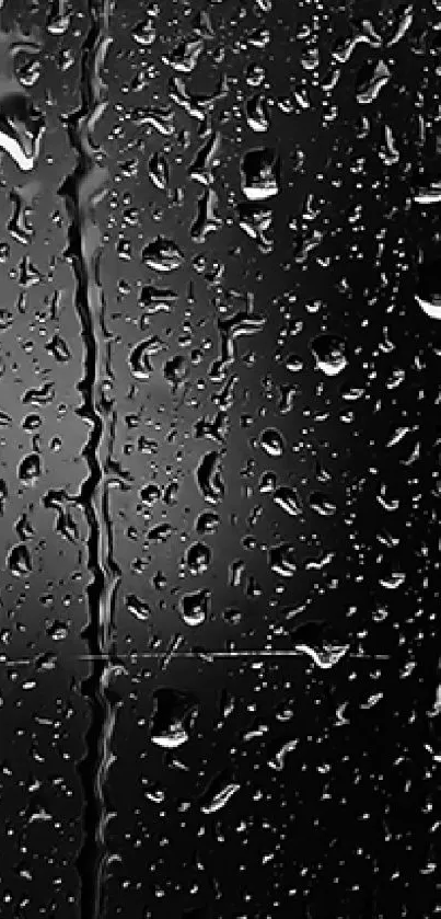 Raindrops on dark glass surface, creating a stylish and moody phone wallpaper.