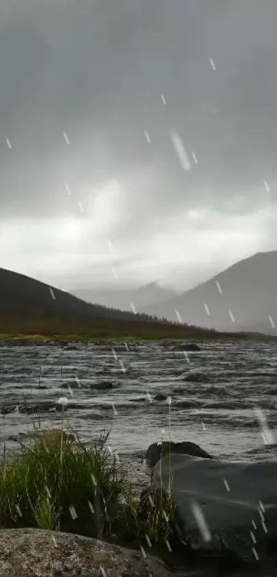 Rainy mountain lake scene with misty hills.