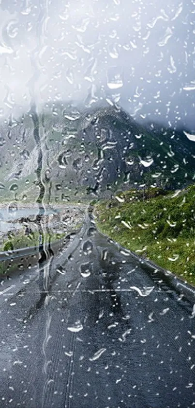 Mobile wallpaper of a rainy road with a mountain view.