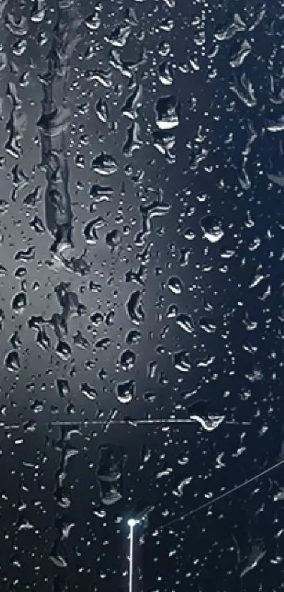 Serene rainy night wallpaper with raindrops on a dark blue surface.