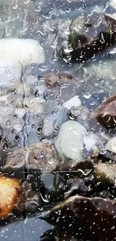 Pebbles submerged in water with raindrops creating a reflective surface.