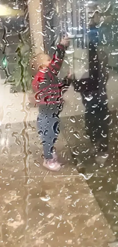 Child's reflection on a rain-speckled window for mobile wallpaper.