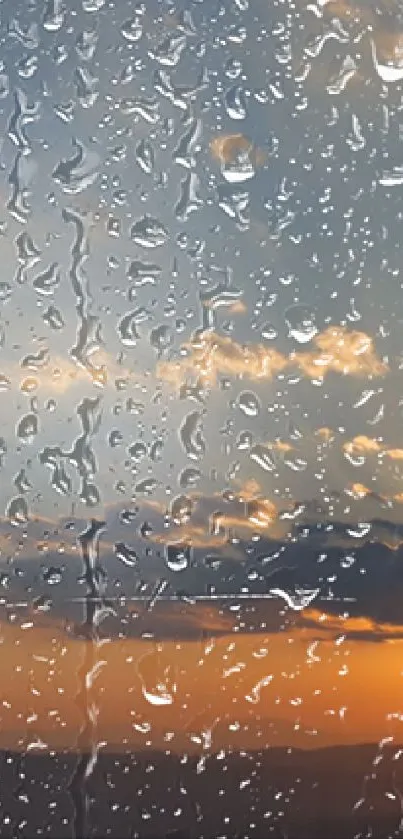 Raindrops on window with sunset sky.