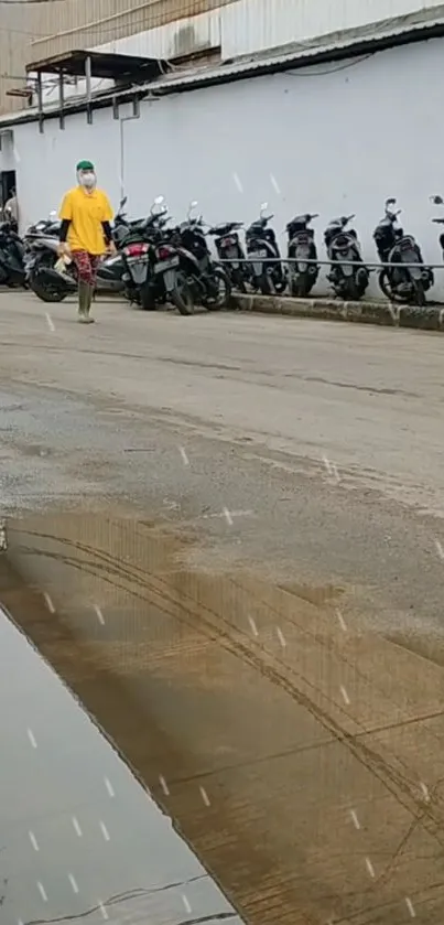 A rainy urban street with motorbikes and reflections in a puddle.