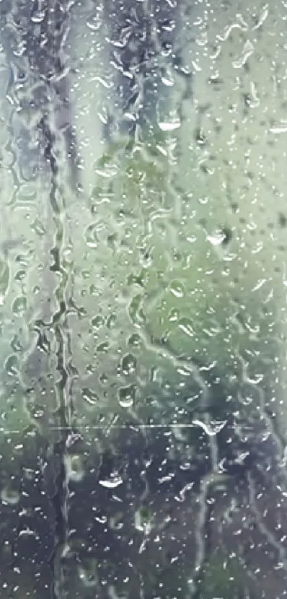 Rainy glass window with blurry background, creating a serene mobile wallpaper aesthetic.