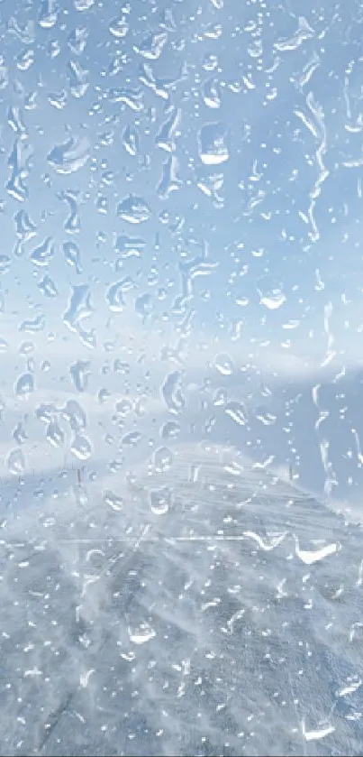 Wallpaper of raindrops on a window with a view of the sky.