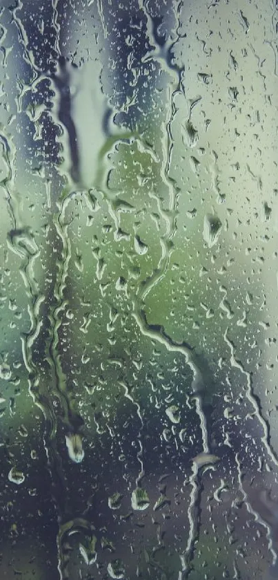 Tranquil rainy window wallpaper with soft blue-gray hues.