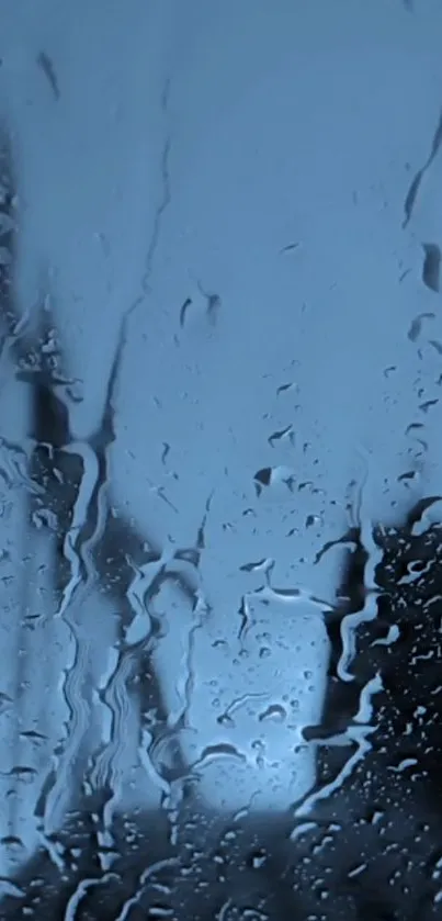 Rain-covered window with blue tones, perfect for calm phone wallpaper.