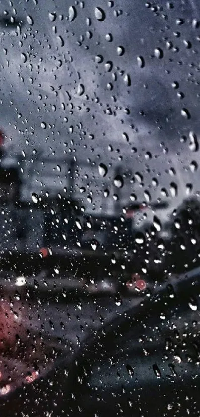 Rain droplets on a window with a city background.