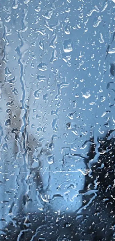 Raindrops on window with blue sky in mobile wallpaper.