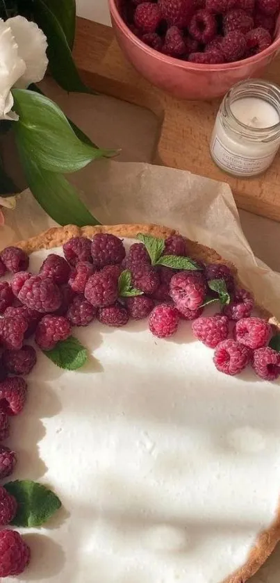 Raspberry tart with fresh raspberries on parchment in a rustic kitchen setting.