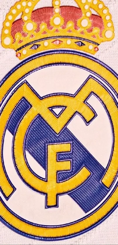 Real Madrid emblem on pale pink background wallpaper.