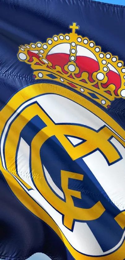 Blue Real Madrid flag waving in the sky, showcasing iconic team logo.