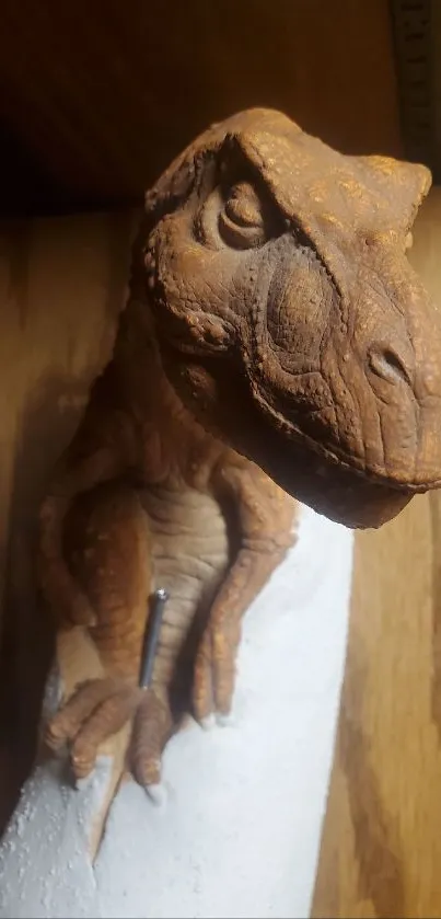 Realistic dinosaur statue on wooden surface.