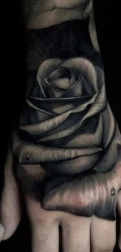 Black and gray rose tattoo on a hand, artistic design.