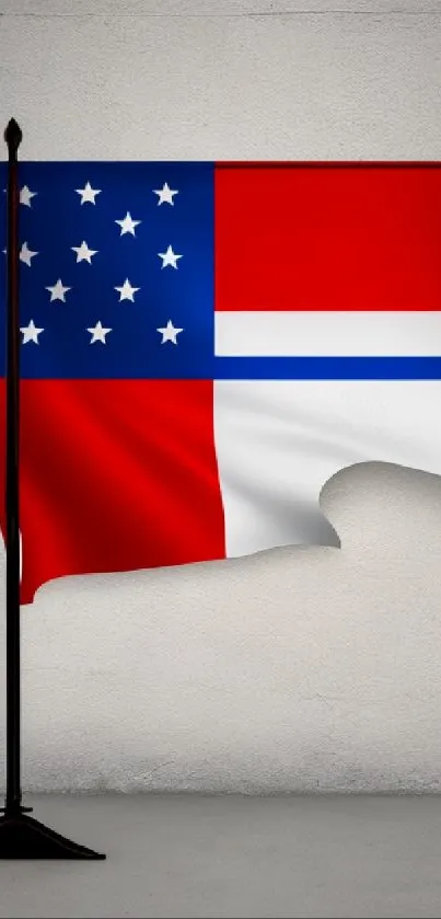 Red, white, and blue flag on a stand against a gray background.