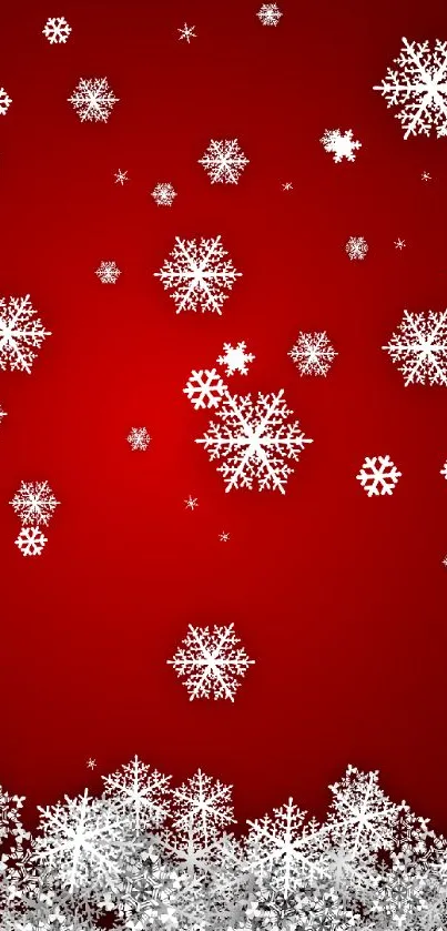 Red background with white snowflakes falling.